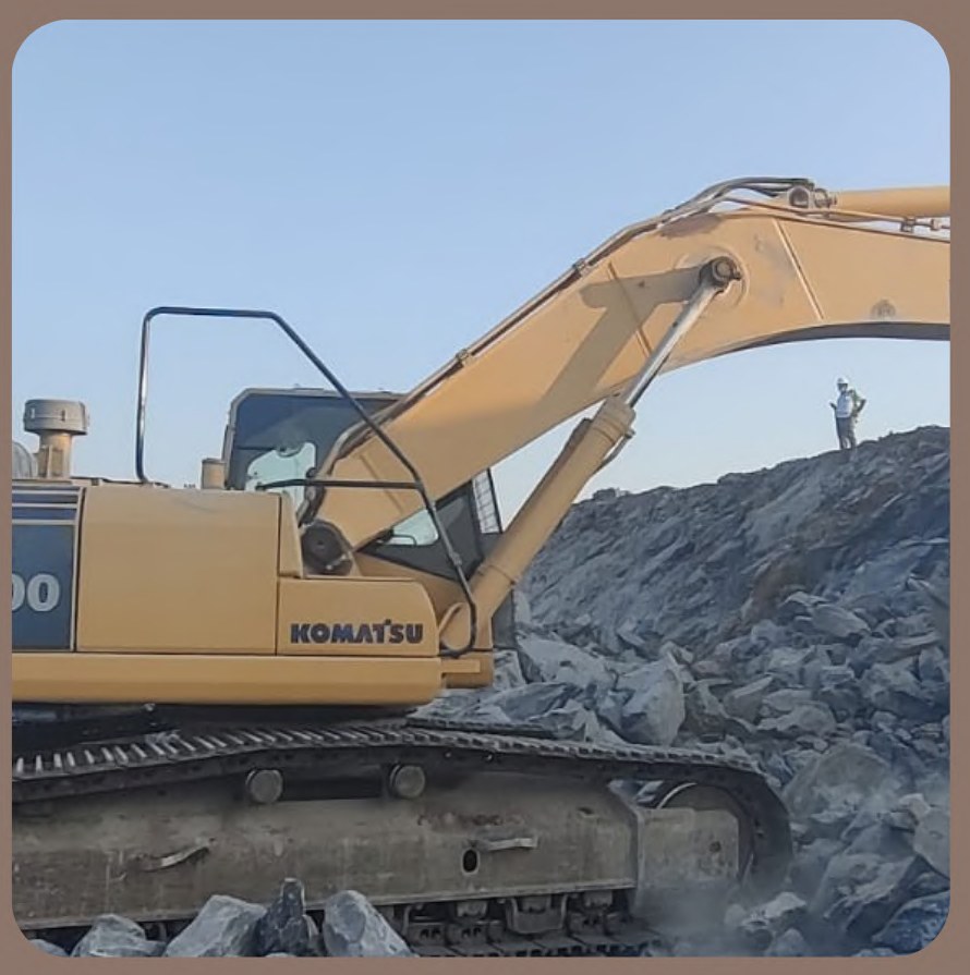 Excavator loading limestone